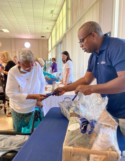 Fussell Group Insurance Agent handing out swag at the Center for Seniors event